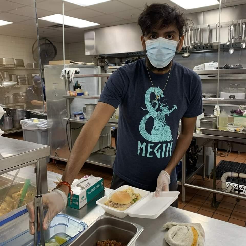 Avi Bajaj prepares meals in the Schenectady, NY City Mission