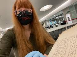 Doing research in the Wolfson Reading Room representing Stony Brook with my choice of facemask