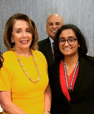 Photo of Nancy Pelosi with SBU alumna Michelle Olakkengil