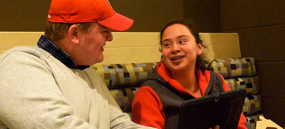 Quality Assurance and Compliance Manager Riley O'Connor speaks with Sophomore student Karla Reyes-Ortiz about the steps Campus Dining takes to keep food safe