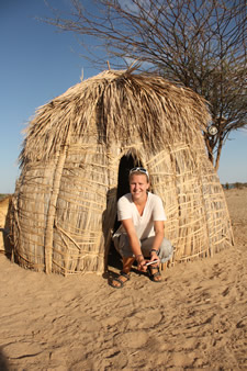 Debbie Aller in a hut in Tanzania