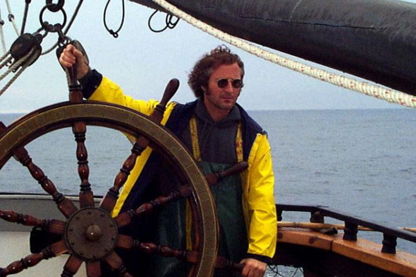 Gene Carl Feldman at the ship's wheel